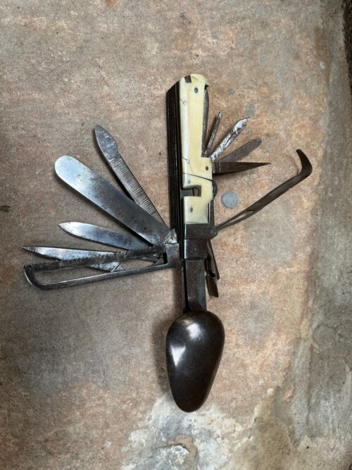 Vintage brass hand carving and..........knife with 20 options...