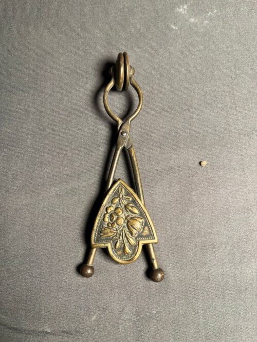 Antique brass Victorian skirt lifter