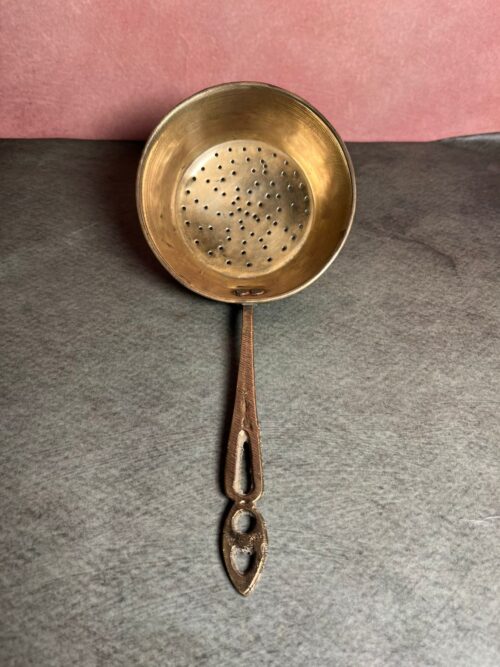 Vintage brass tea strainer