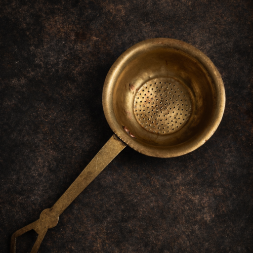 Vintage brass tea strainer