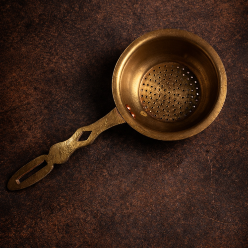 Vintage brass tea strainer