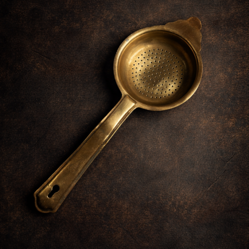Vintage brass tea strainer
