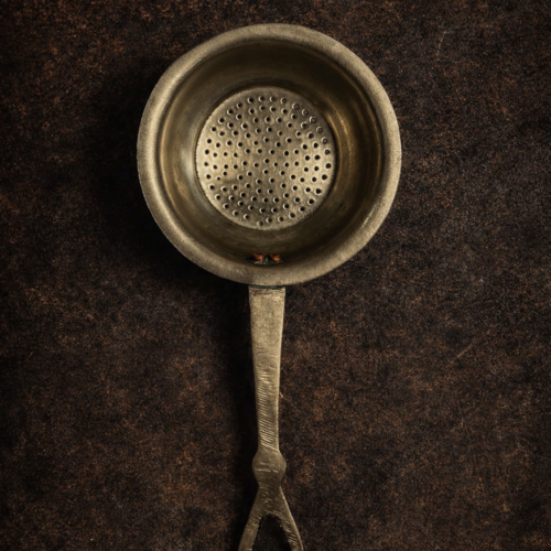 Vintage brass german silver tea strainer