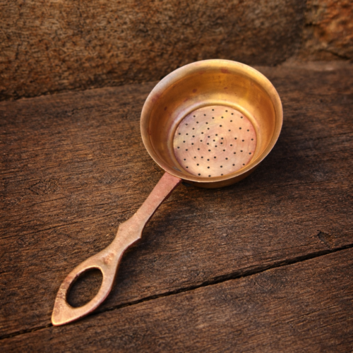 Vintage brass tea strainer