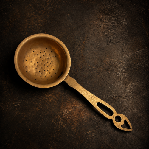 Vintage brass tea strainer