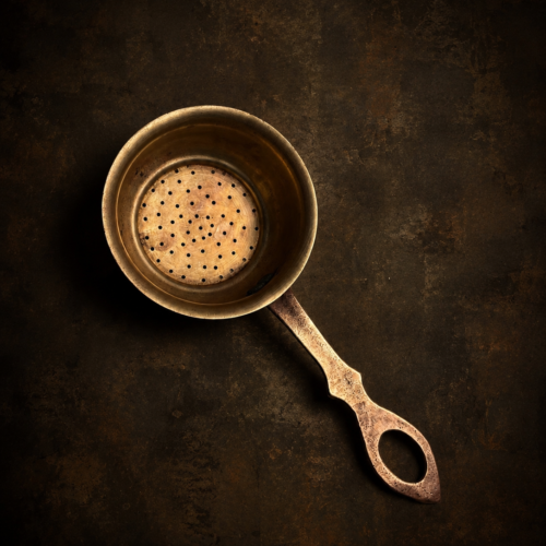 Vintage brass tea strainer