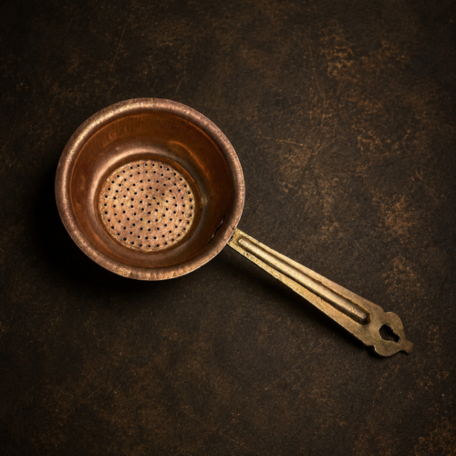Vintage brass tea strainer